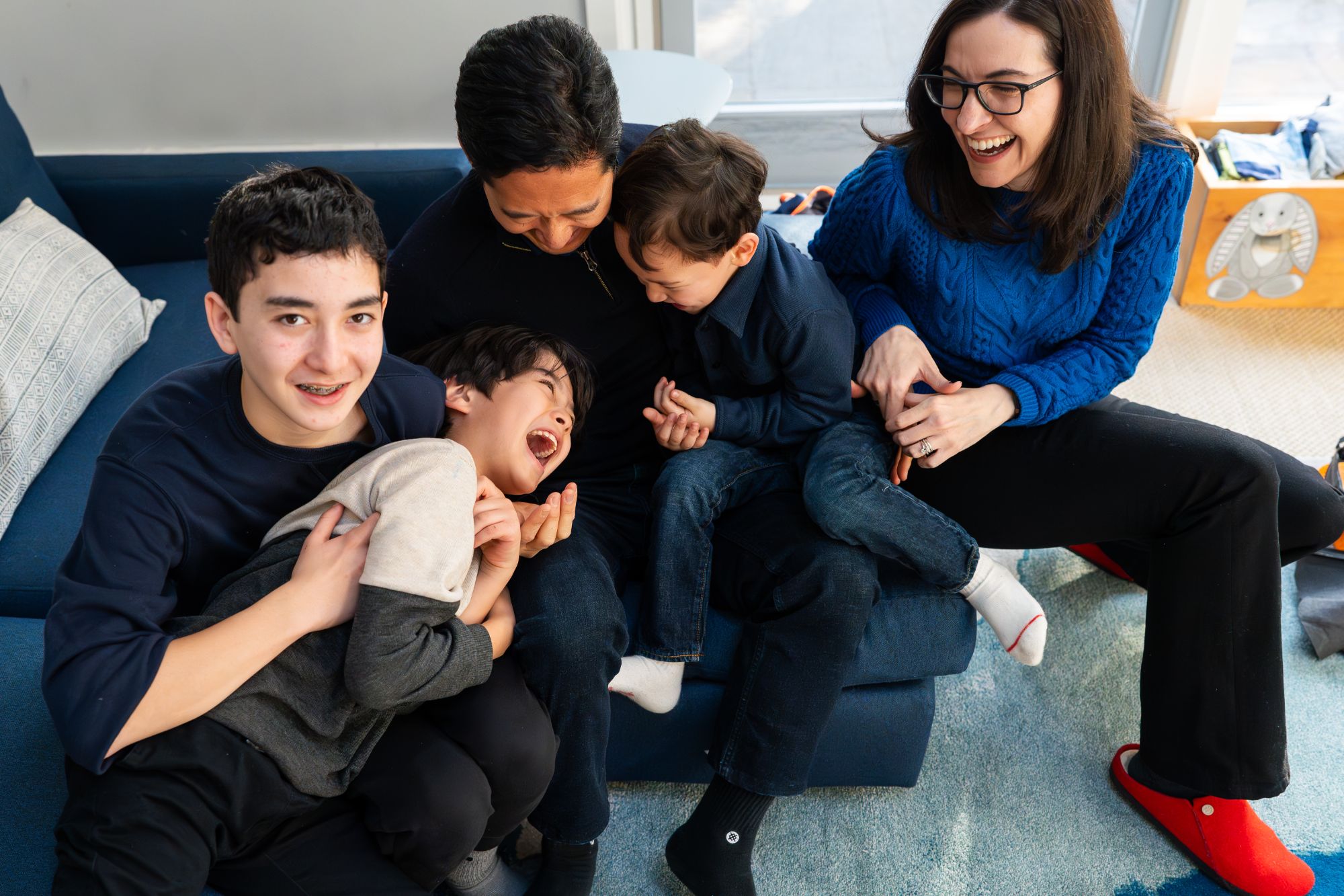 Family having fun during relaxed in home photo session