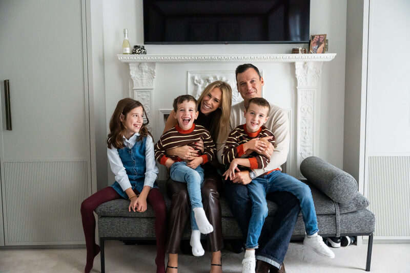 Relaxed in home family session captured by a family travel photographer